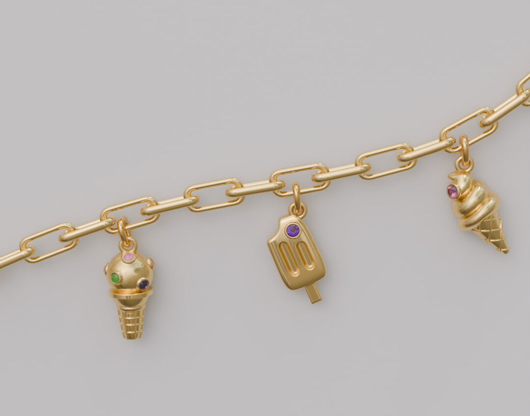 展示冰淇淋主題的吊墬，每款都鑲嵌彩色天然寶石，呈現繽紛可愛的視覺感，簡單的背景